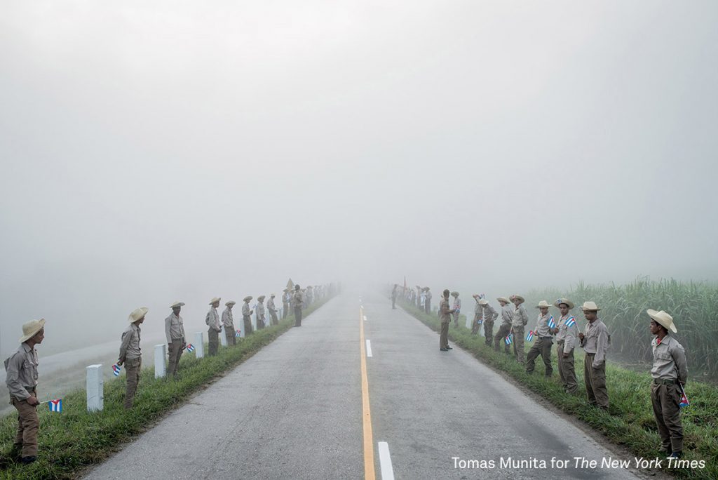 Members of the Ejercito Juvenil del Trabajo wait along the road to Santiago de Cuba at dawn for Fidel Castro’s caravan. Cuba declared nine days of mourning after Fidel Castro’s death, a period that culminated with his funeral. Story: In December, days after Fidel Castro’s death, his ashes were taken into the countryside, on a route that retraced, in reverse, the steps of the revolution he led in 1959. Towns and villages along the route were emptied of residents as thousands tried to catch a glimpse of Castro’s remains. For many, the death of Fidel Castro felt like that of a father. In death, as in life, Fidel Castro demanded reverence. Cuba brims with life, a contrast drawn sharper amid its faded grandeur. From one end of the country to the other, thousands of Cubans waited to bid farewell to Fidel.