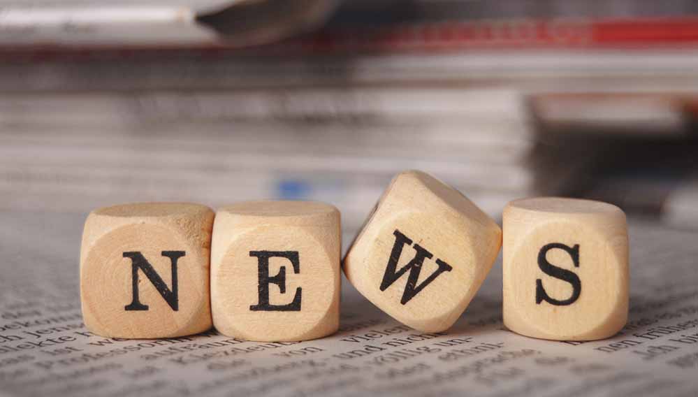 Würfel bilden das Wort NEWS